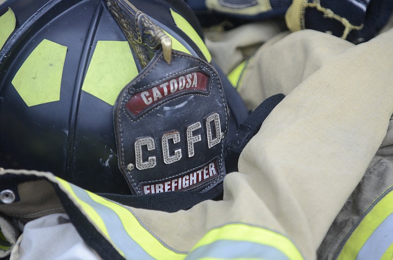 Catoosa County fire gear lies on the ground between competitions.