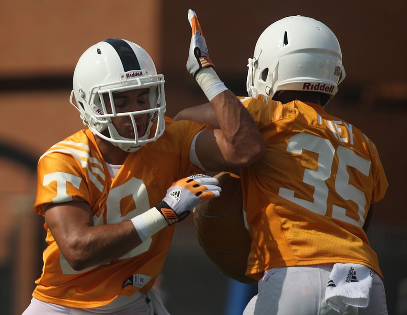 Devaun Swafford, left, is one of two freshmen playing in Tennessee's secondary when it includes five players.