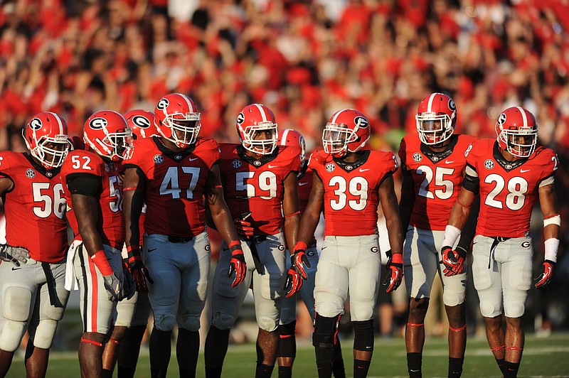 Georgia defensive players, from left, end Garrison Smith (56), linebacker Amarlo Herrera (52), end Ray Drew (47), linebacker Jordan Jenkins (59), strong safety Corey Moore (39), strong safety Josh Harvey-Clemons (25), free safety Tray Matthews (28).