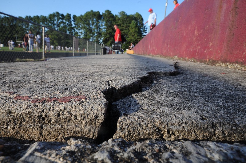 Cracks are visible in the old concrete stands at Tyner Academy's football stadium.