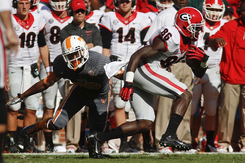 Georgia's Justin Scott-Wesley passes Tennessee defensive back LaDarrell McNeil (33) to gain a first down in this file photo.