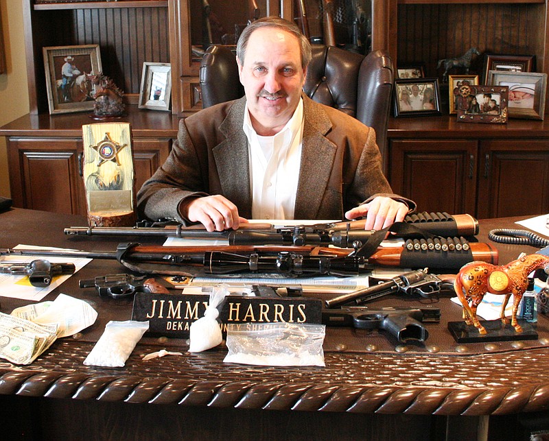 DeKalb County Sheriff Jimmy Harris shows guns seized in the arrest of John William Goodale, 39 of Henagar, Ala.,