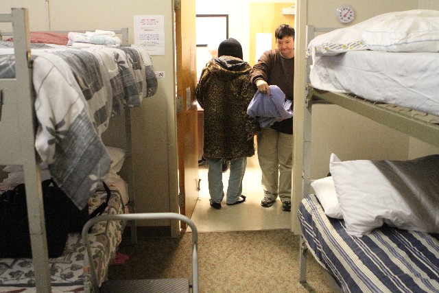 Shirley Hayden, left, and Nora Stough settle in at the Chattanooga Rescue Mission to sleep out of the cold on Friday in Chattanooga.