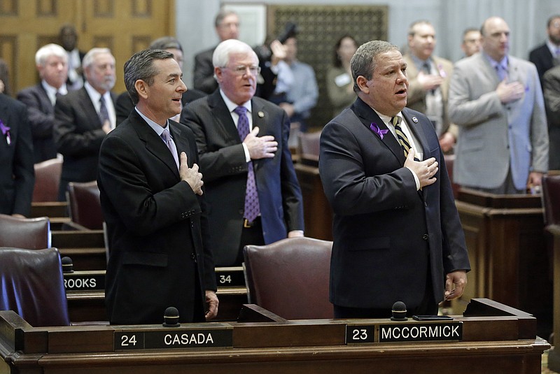 In this 2014 file photo, Tennessee House members, including Rep. Glen Casada, R-Franklin, left, and Rep. Gerald McCormick, R-Chattanooga, right, say the Pledge of Allegiance as the 108th General Assembly is reconvened in Nashville. 