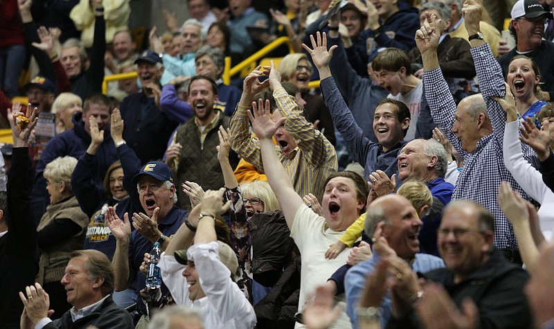 The crowd cheers after UTC scores on a half-court shot as the buzzer rings at the end of the first half against Elon at McKenzie Arena on Jan. 23.