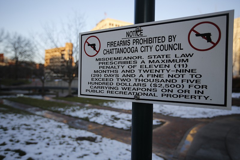 A sign prohibiting firearms by Chattanooga city ordinance is seen at Miller Park in Chattanooga. 