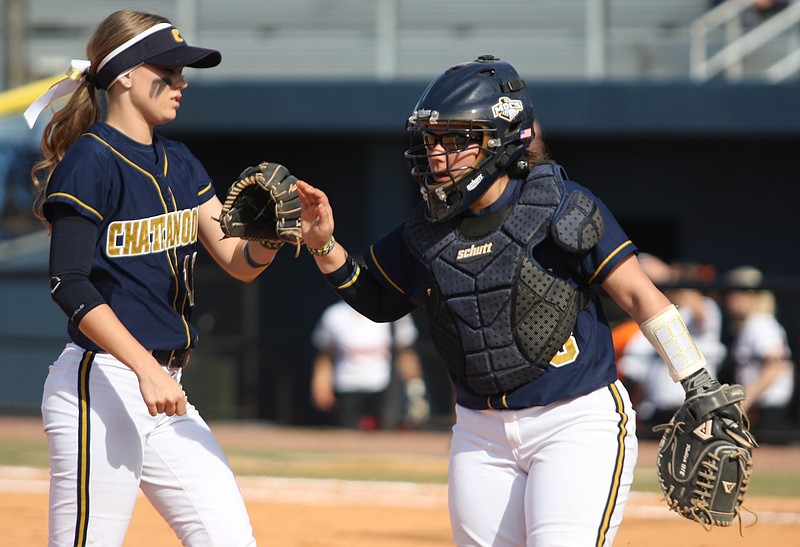 UTC's Alyssa Taylor, left, and Anyssa Robles celebrate retiring the side in the second inning of their 3-1 win over Campbell University in the Frost Classic finale at Jim Frost Stadium on Sunday.