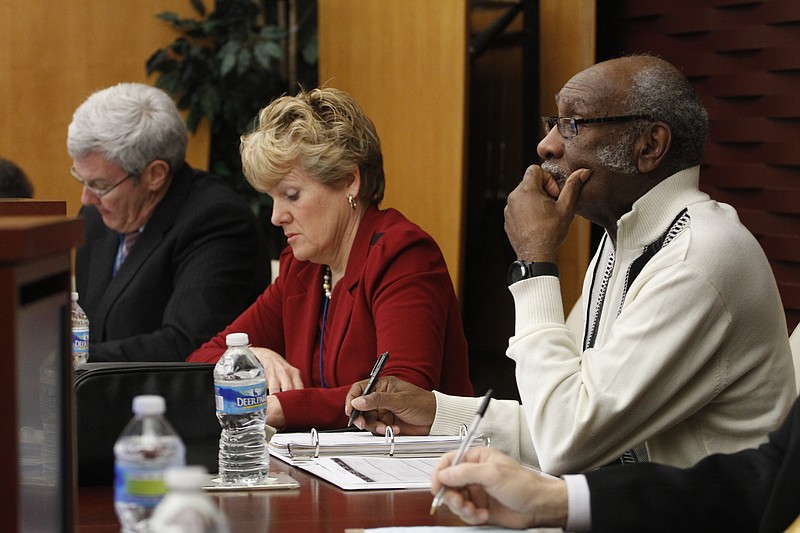 Eddie F. Holmes, right, speaks during the Chattanooga Housing Authority's board meeting in this file photo.