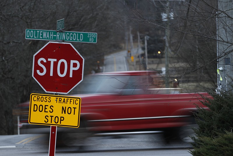 Motorists on Standifer Gap Road stop for cross traffic on Ooltewah-Ringgold Road early Tuesday morning. A growing number of crashes at the intersection has officials looking for a solution, probably a roundabout.