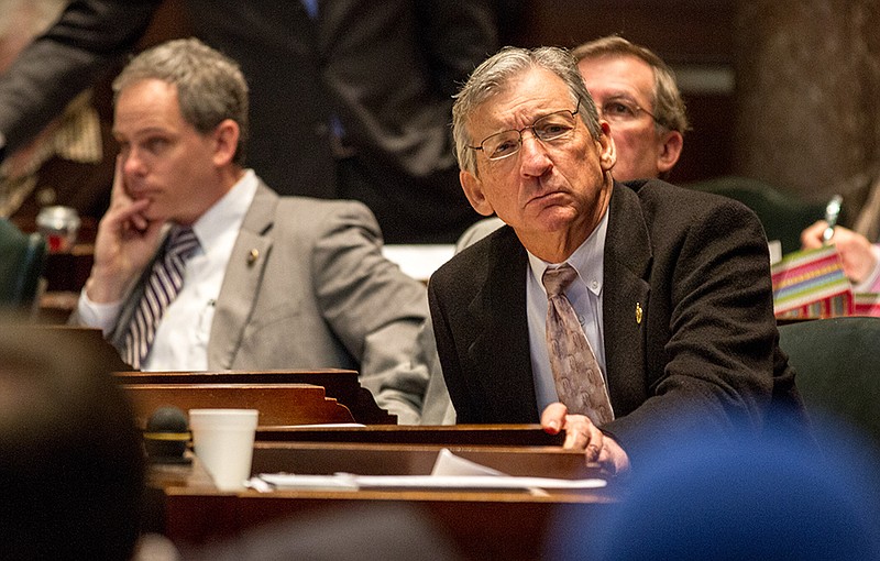 Republican Sen. Frank Niceley of Strawberry Plains, right, listens to proceedings on the Senate floor in Nashville.