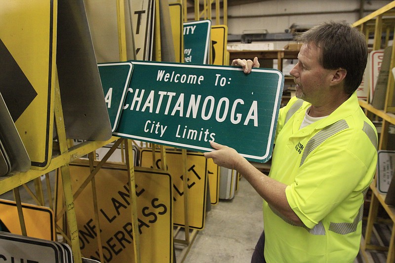Pete Woodard shows off new Chattanooga city limits signs at the City of Chattanooga Traffic Operations building.