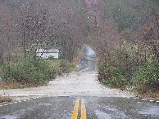 A local road is seen flooded in the file photo, tile.