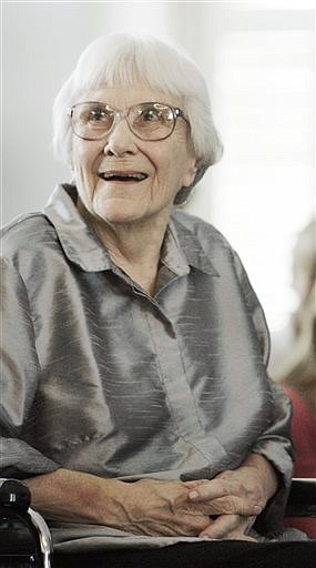 In this Aug. 20, 2007, file photo, author Harper Lee smiles during a ceremony honoring the four new members of the Alabama Academy of Honor at the Capitol in Montgomery, Ala. "To Kill a Mockingbird" will be made available as an e-book and digital audiobook in July 2014, filling one of the biggest gaps in the electronic library. Author Harper Lee said in a rare public statement Monday, April 28, 2014, issued through HarperCollins Publishers, that while she still favored "dusty" books she had signed on for making "Mockingbird" available to a "new generation." (AP Photo/Rob Carr, File)