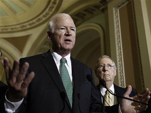 During a news conference Tuesday, June 4, 2014, on Capitol Hill in Washington, Senate Intelligence Committee Vice Chairman Sen. Saxby Chambliss, R-Ga., left, accompanied by Senate Minority Leader Mitch McConnell of Ky., disparage the Obama administration's decision to swap Army Sgt. Bowe Bergdahl.