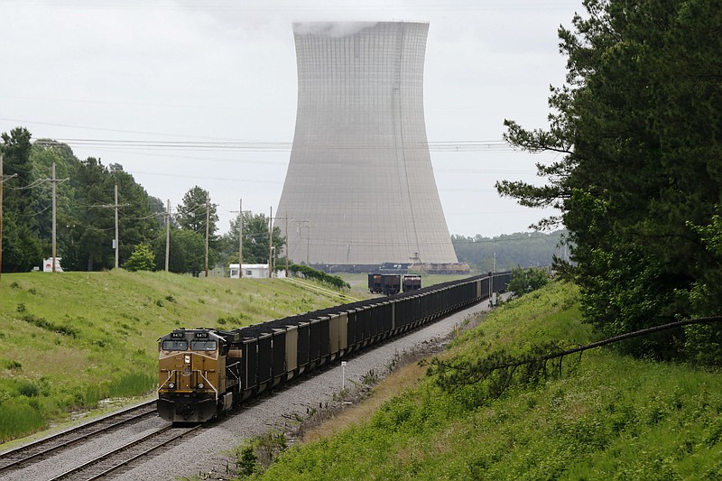 
              This photo taken June 2, 2014, shows a coal train stops near White Bluff power plant near Redfield, Ark. President Barack Obama’s new pollution limits for power plants have set off an avalanche of information about what the rules will cost, how they’ll affect your health, and how far they’ll go toward curbing climate change. There’s just one problem: Almost none of it is based in reality. That’s because Obama’s proposed rules, which aim to cut carbon dioxide emissions from power plants 30 percent by 2030, rely on states developing their own, customized plans to meet their targets. Among the options: switching to cleaner fuel sources, boosting efficiency to reduce demand for electricity and trading pollution permits through cap-and-trade. (AP Photo/Danny Johnston)
            