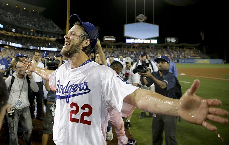 
              Los Angeles Dodgers starting pitcher Clayton Kershaw celebrates his no-hitter against the Colorado Rockies after  a baseball game in Los Angeles, Wednesday, June 18, 2014. Kershaw struck out a career-high 15 batters. (AP Photo/Chris Carlson)
            