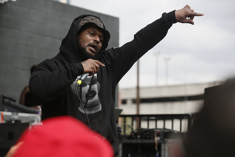 
              FILE - In this March 14, 2014 file photo, Schoolboy Q performs during the SXSW Music Festival in Austin, Texas. The rapper was in a vehicle that was fired on after a concert at the popular Red Rocks outdoor amphitheatre in Colorado, but he was not injured, investigators said Friday, June 20, 2014. Three other people were hurt in the shooting late Thursday in the parking lot at Red Rocks, but their injuries were not life-threatening, and one was discharged from the hospital Friday. (Photo by Jack Plunkett/Invision/AP, file)
            