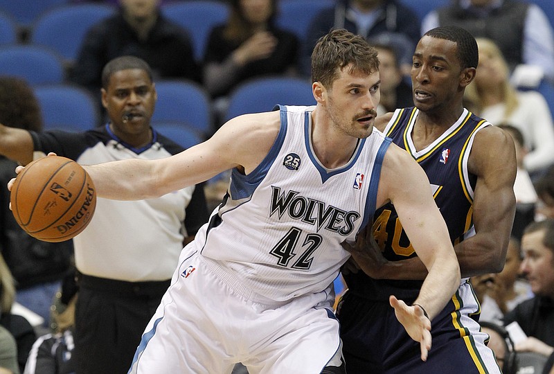 
              FILE - In this Wednesday, April 16, 2014, file photo, Minnesota Timberwolves forward Kevin Love (42) drives against Utah Jazz forward Jeremy Evans during the first quarter of an NBA basketball game in Minneapolis. Three-time NBA All-Star Love could hear his name called on draft night _ again. The Minnesota Timberwolves big man headlines a list of veteran NBA players who could have a major influence on how the draft unfolds, on Thursday, June 26, 2014. (AP Photo/Ann Heisenfelt, File)
            