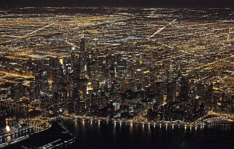 
              FILE - This Sunday, Nov. 24, 2013, file photo, shows an aerial view at night of the downtown Chicago skyline. Star Wars" creator George Lucas has selected Chicago to build his museum of art and movie memorabilia. (AP Photo/Kiichiro Sato, File)
            