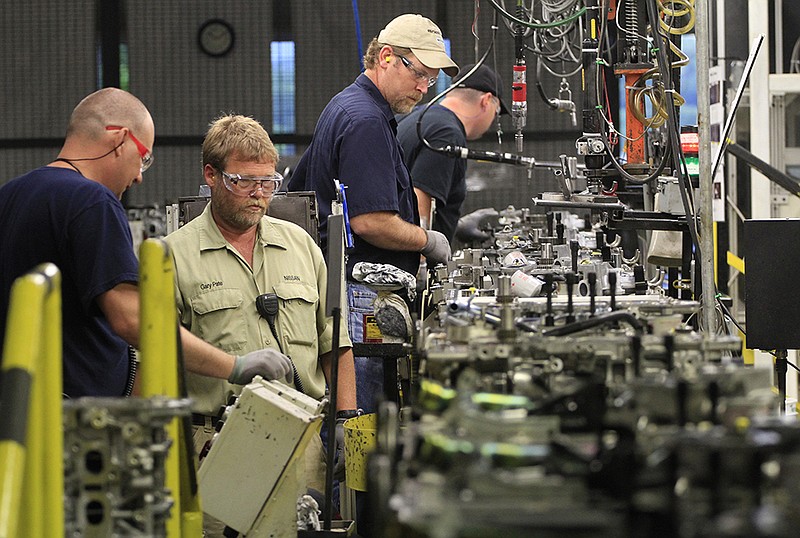 Employees assemble Nissan Altima and Frontier 4-cylinder engines at the Decherd, Tenn., plant.