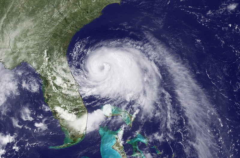
              This Wednesday, July 2, 2014, satellite image taken at 3:35 p.m. EDT and released by the National Oceanic and Atmospheric Administration (NOAA), shows Tropical Storm Arthur moving north off the east coast of Florida. The first named storm of the Atlantic hurricane season prompted a hurricane warning for a wide swath of the North Carolina coast and spurred authorities to order a mandatory evacuation for visitors to the Outer Banks' Hatteras Island as of 5 a.m. Thursday, July 3, 2014. Residents also were advised to leave the island. A voluntary evacuation was announced for the Outer Banks' Ocracoke Island, accessible only by ferry. (AP Photo/NOAA)
            