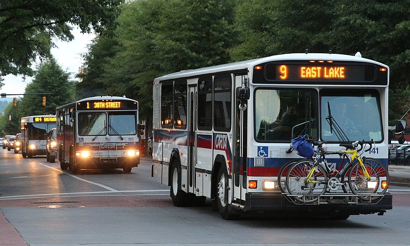 Three CARTA buses head down Broad Street in Chattanooga, Tenn.