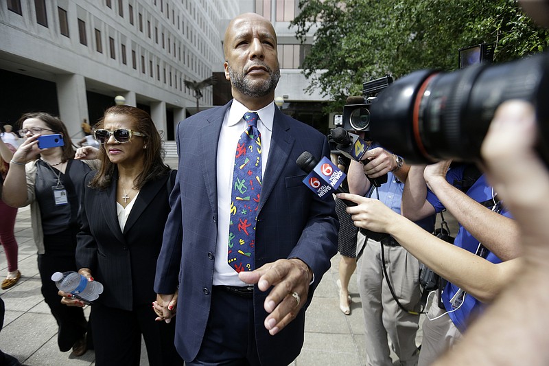 
              Former New Orleans Mayor Ray Nagin leaves federal court, with his wife, Seletha Nagin, left, after being sentenced in New Orleans, Wednesday, July 9, 2014. Nagin was sentenced to 10 years in prison for bribery, money laundering and other corruption that spanned his two terms as mayor, including the chaotic years after Hurricane Katrina hit in 2005. He was convicted Feb. 12 of accepting hundreds of thousands of dollars from businessmen who wanted work from the city or Nagin's support for various projects. The bribes came in the form of money, free vacations and truckloads of free granite for his family business. (AP Photo/Gerald Herbert)
            