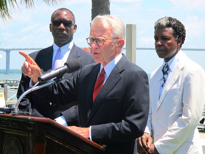 
              Mayor Joseph P. Riley Jr., center, announces that a $75 million International African American Museum will be built at the site of a wharf in Charleston, during a July 15, 2014 news conference in Charleston, S.C. The site is where tens of thousands of slaves first set foot in the United States. Behind the mayor are Wilbur Johnson, left, the chairman of the board of the museum, and artist Jonathan Green, whose colorful paintings of the black culture of the sea islands of the Southeast coast are in collections worldwide. Riley said construction of the museum could begin in early 2016 with completion two years later. (AP Photo/Bruce Smith)
            