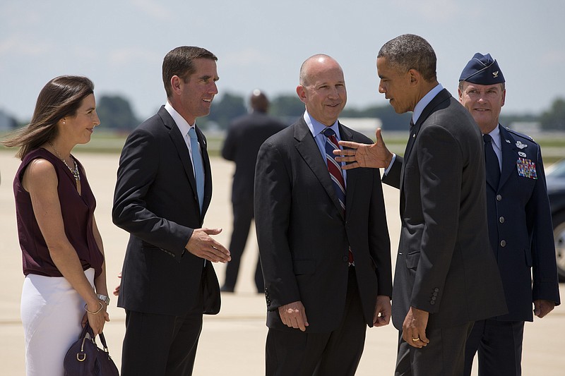 
              President Barack Obama shakes hands with Delaware Attorney General Beau Biden, left, next to Biden's wife Hallie Biden, far left, and Delaware Gov. Jack Markell as he arrives at New Castle Air National Guard Base in New Castle, Del., Thursday, July 17, 2014, en route to Wilmington where he is expected to visit the site of the damaged I-495 bridge in Wilmington to speak about transportation and infrastructure. (AP Photo/Jacquelyn Martin)
            