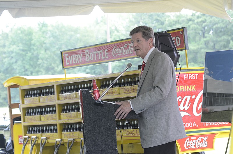 Claude Nielsen, chief executive officer of Coca-Cola Bottling Co., speaks Monday during a ceremony to break ground at the company's new distribution and sales facility at the former Olan Mills site in Chattanooga.