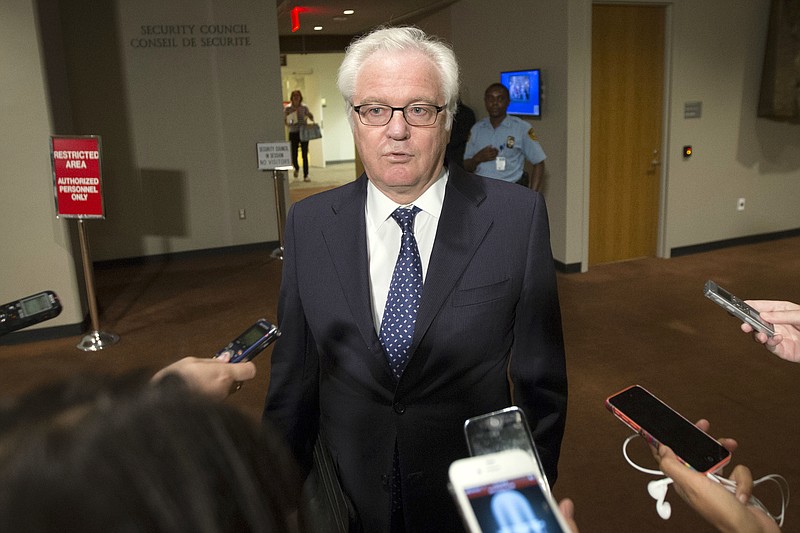 
              Russian U.N. Ambassador Vitaly Churkin speaks to the media during an emergency meeting of the U.N. Security Council on the worsening situation in Gaza at United Nations headquarters, Sunday, July 20, 2014. A Jordan-drafted resolution obtained by The Associated Press expresses "grave concern" at the high number of civilians killed in Gaza, including children, and it calls for an immediate cease-fire, "including the withdrawal of Israeli occupying forces from the Gaza Strip." (AP Photo/John Minchillo)
            