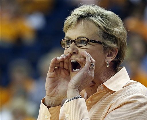 In this March 9, 2014, file photo, Tennessee head coach Holly Warlick yells from the bench in the first half of an NCAA college basketball game against Kentucky in the finals of the Southeastern Conference women's tournament in Duluth, Ga.