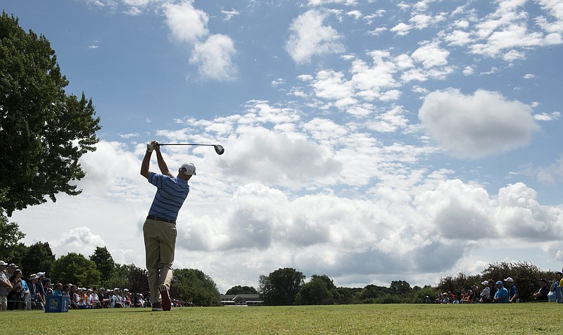 Jim Furyk hits from the ninth tee Sunday during the final round of the Canadian Open golf tournament in Montreal. (AP Photo/The Canadian Press, Paul Chiasson)