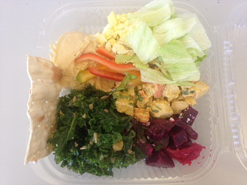 You get to build your own meal from the hot, cold and salad bars at the Grocery Bar. A recent visit included kale and pickled beet salads, hummus, sliced peppers, crackers, curry chicken, iceberg lettuce and diced egg.