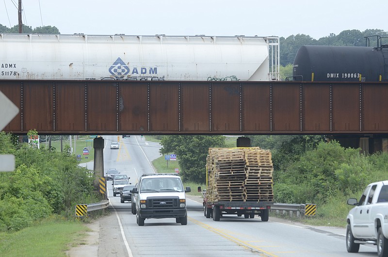 Traffic moves Thursday down Bonny Oaks Drive.