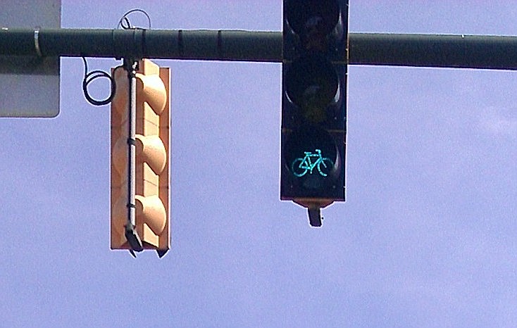 The city's first traffic signal for bicycles went into operation at the north end of the Walnut Street Bridge at Frazier Avenue.