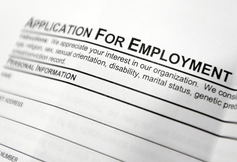 
              FILE - This April 22, 2014, file photo shows an employment application form on a table during a job fair at Columbia-Greene Community College in Hudson, N.Y.  The Labor Department reports on the number of people who applied for unemployment benefits last week on Thursday, July 31, 2014. (AP Photo/Mike Groll, File)
            