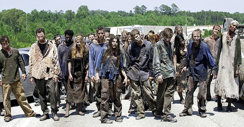Zombies appear in a scene from the second season of the AMC original series, "The Walking Dead," in Senoia, Ga.