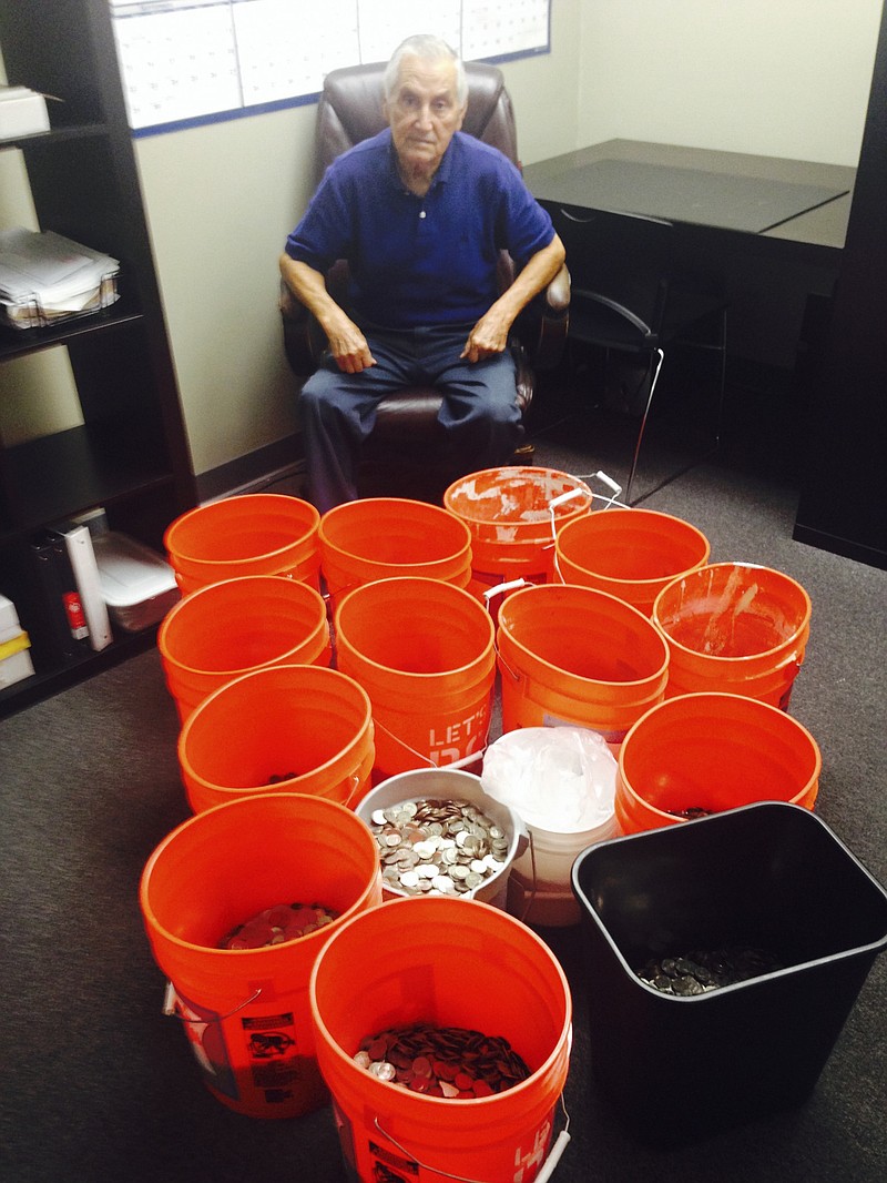 
              This image provided by Andres Carrasco shows him in his office in Los Angeles, July 31, 2014 with buckets of change he won as a partial settlement in a 2012 lawsuit against Adriana’s Insurance Services, a Rancho Cucamonga, Calif.-based company. The insurance company settled with Carrasco, by dropping off buckets full of thousands dollars in quarters, nickels, dimes and pennies. (AP Photo
            