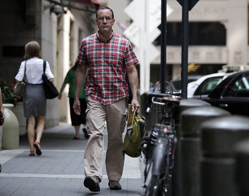 
              In this July 22, 2014 photo, AIDS activist Gregg Gonsalves walks outside Grand Central Terminal during a photo session, in New York. In the early 1990s, Gonsalves traveled to Washington to confront, provoke and challenge officials at the Food and Drug Administration. A quarter century later, he still travels to Washington, but with a very different agenda: to defend the FDA. (AP Photo/Richard Drew)
            