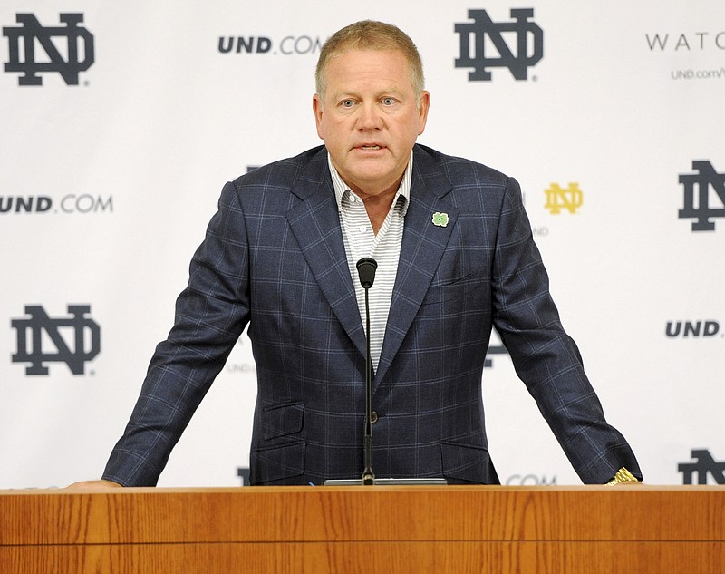
              FILE - In this Aug. 1, 2014, file photo, Notre Dame football coach Brian Kelly talks to the media at the beginning of fall practice in South Bend, Ind. Notre Dame says it is investigating "suspected academic dishonesty" involving several students, including four members of the football team. The school released a statement Friday, Aug. 15 saying it has notified the NCAA and that because of potential NCAA violations the four players are being held out of practice and completion until the conclusion of the investigation and the university honor code process. (AP Photo/Joe Raymond, File)
            