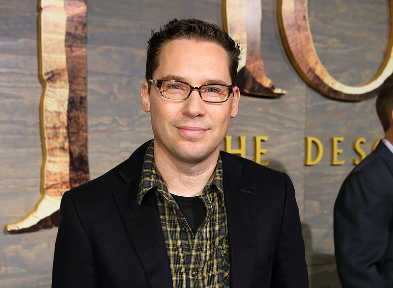 
              FILE - This Dec. 2, 2013 file photo shows Bryan Singer at the Los Angeles premiere of "The Hobbit: The Desolation of Smaug" at the Dolby Theatre. A former child model accusing “X-Men” director Bryan Singer of sex abuse in Hawaii said he wants to dismiss the lawsuit _ not because it lacks merit but because he can’t find a new attorney to represent him. Michael Egan III said in a court filing Wednesday that he previously sought the dismissal in sealed documents in federal court in Honolulu. He wants the case dismissed without prejudice, meaning he could file it again later. (Photo by Matt Sayles/Invision/AP, File)
            