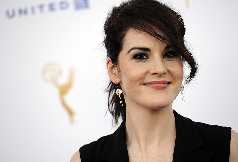 
              Michelle Dockery, an Emmy nominee for lead actress in a drama series for "Downton Abbey," poses at the 66th Emmy Awards Performers Nominee Reception on Saturday, Aug. 23, 2014, in West Hollywood, Calif. (Photo by Chris Pizzello/Invision/AP)
            