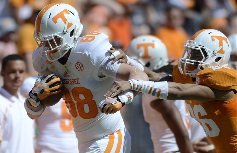 Tennessee freshman tight end Ethan Wolf, left, will get his first taste of big-time college football tonight when the Vols host Utah State to open the 2014 season.