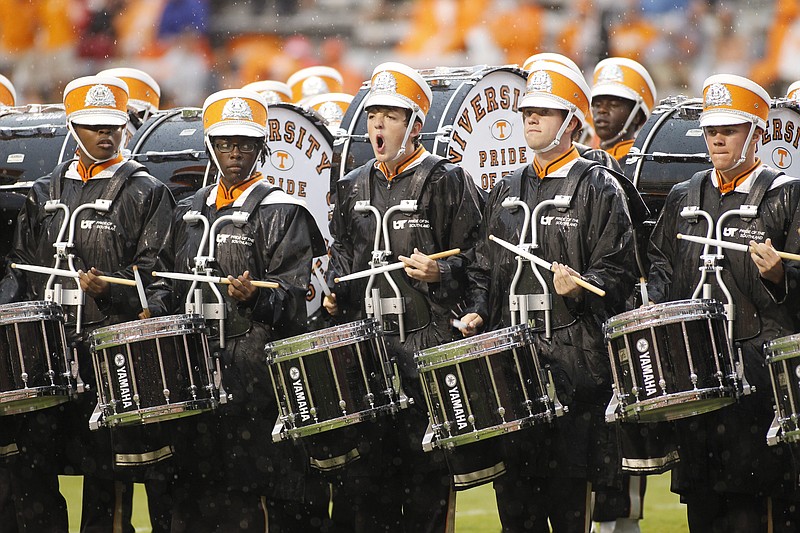 Pride of the Southland Band drummers play in the rain at the start of the Vols' season-opener football game.