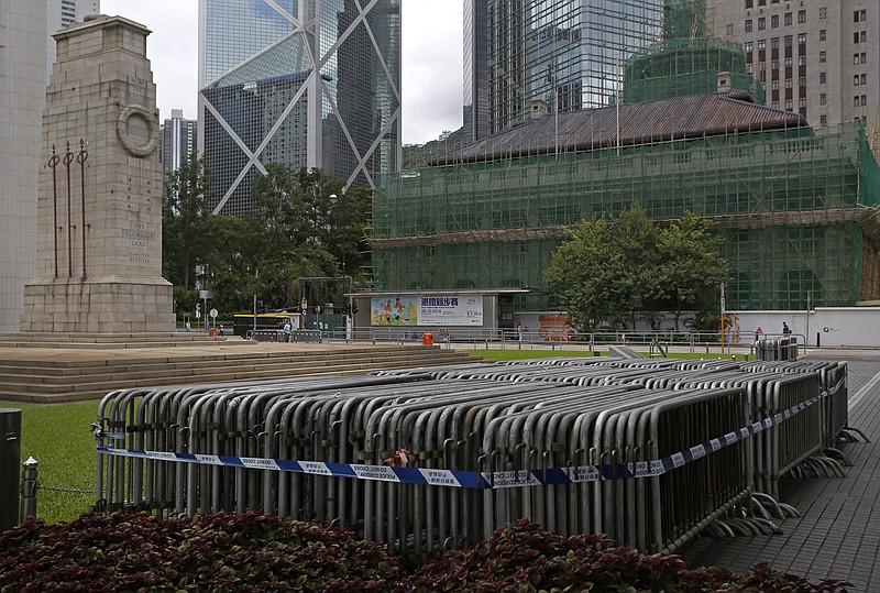 
              Iron barriers are prepared for the possible protest at the financial Central district in Hong Kong Sunday, Aug. 31, 2014. China's legislature on Sunday ruled against allowing open nominations in elections for Hong Kong's chief executive, a decision that promises to ignite political tensions in the Asian financial hub. Hong Kong democracy activists have held massive protests demanding that Chinese leaders let the city's voters choose their chief executive from an open list of candidates.(AP Photo/Vincent Yu)
            