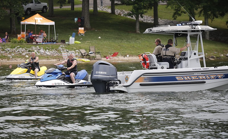 Hamilton County deputies question two jet ski riders from one of the department's two Boston whaler boats on Dallas Bay in this May photo at Chester Frost Park.