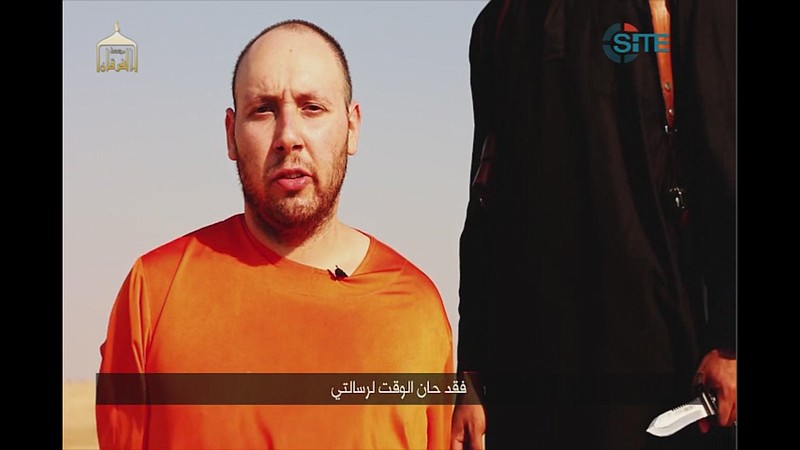
              EDS NOTE: GRAPHIC CONTENT - This image made from video posted on the Internet by Islamic State militants and provided by the SITE Intelligence Group, a U.S. terrorism watchdog, on Tuesday, Sept. 2, 2014, purports to show journalist Steven Sotloff before he was beheaded. Sotloff had last been seen in Syria in August 2013 until he appeared in a video released online by the Islamic State group on Aug. 19, 2014, that showed the beheading of fellow American journalist James Foley. The Arabic text at the bottom of the frame translates to "Now is the time for my message." (AP Photo)
            