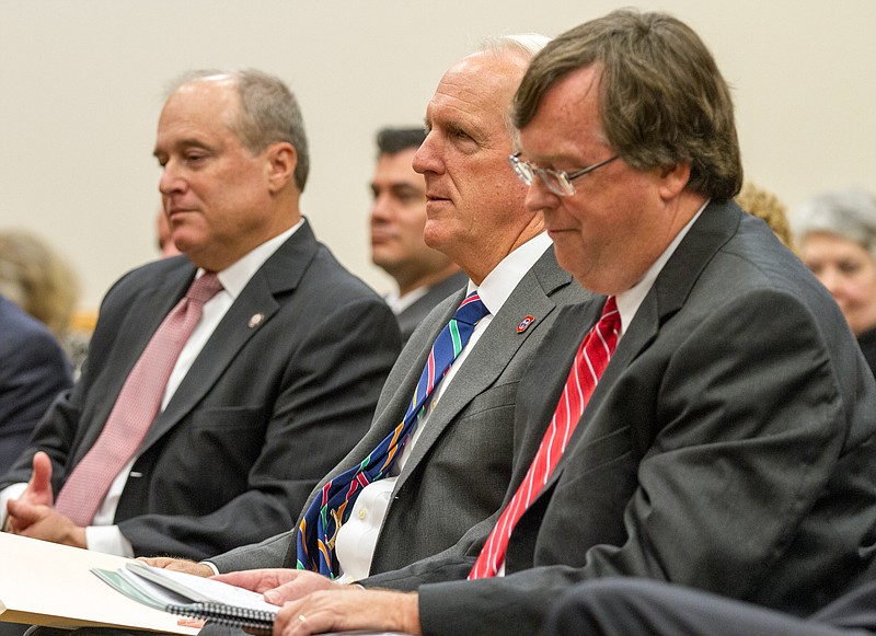 
              Candidates for attorney general wait to speak to before the members of state Supreme Court in Nashville, Tenn., on Monday, Sept. 8, 2014. From right are courts administrator Bill Young, Gov. Bill Haslam's legal adviser Herbert Slatery and state Sen. Doug Overbey, R-Maryville. (AP Photo/Erik Schelzig)
            