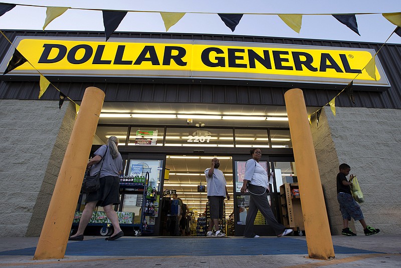 
              FILE - In this Wednesday, Sept. 25, 2013, file photo, customers exit a Dollar General store, in San Antonio. Dollar General is going hostile with its $9.1 billion bid for Family Dollar after repeated rejections of previous offers by its rival. The discount chain said Wednesday Sept. 10, 2014 that it is offering investors of Family Dollar Inc. $80 per share in cash, the same offer that was rejected last week by the company board. (AP Photo/Eric Gay, File)
            